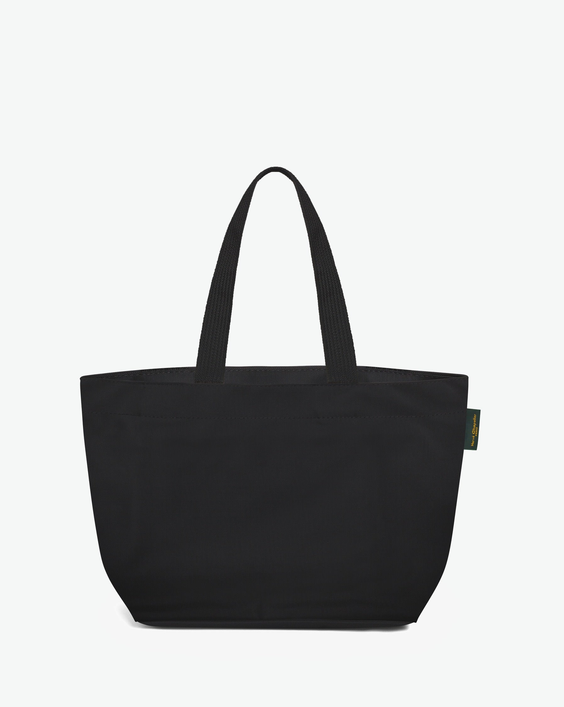 Sac cabas porté épaule de couleur en nylon bicolore, à fond rectangulaire et dans un format M. Présence d'un double zip, d'anses longues noires en polypropylène, et d'une étiquette de marque verte.
