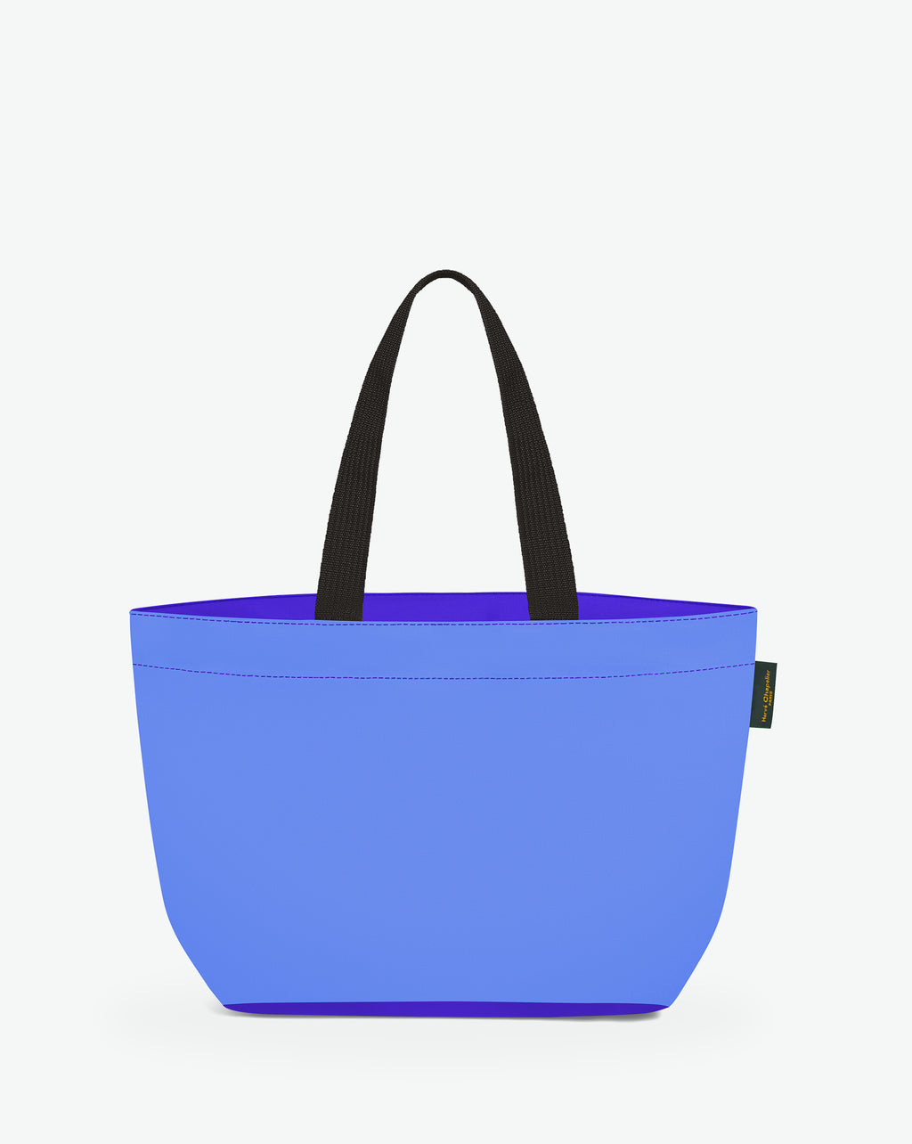 Sac cabas porté épaule de couleur en nylon bicolore, à fond rectangulaire et dans un format M. Présence d'un double zip, d'anses longues noires en polypropylène, et d'une étiquette de marque verte.