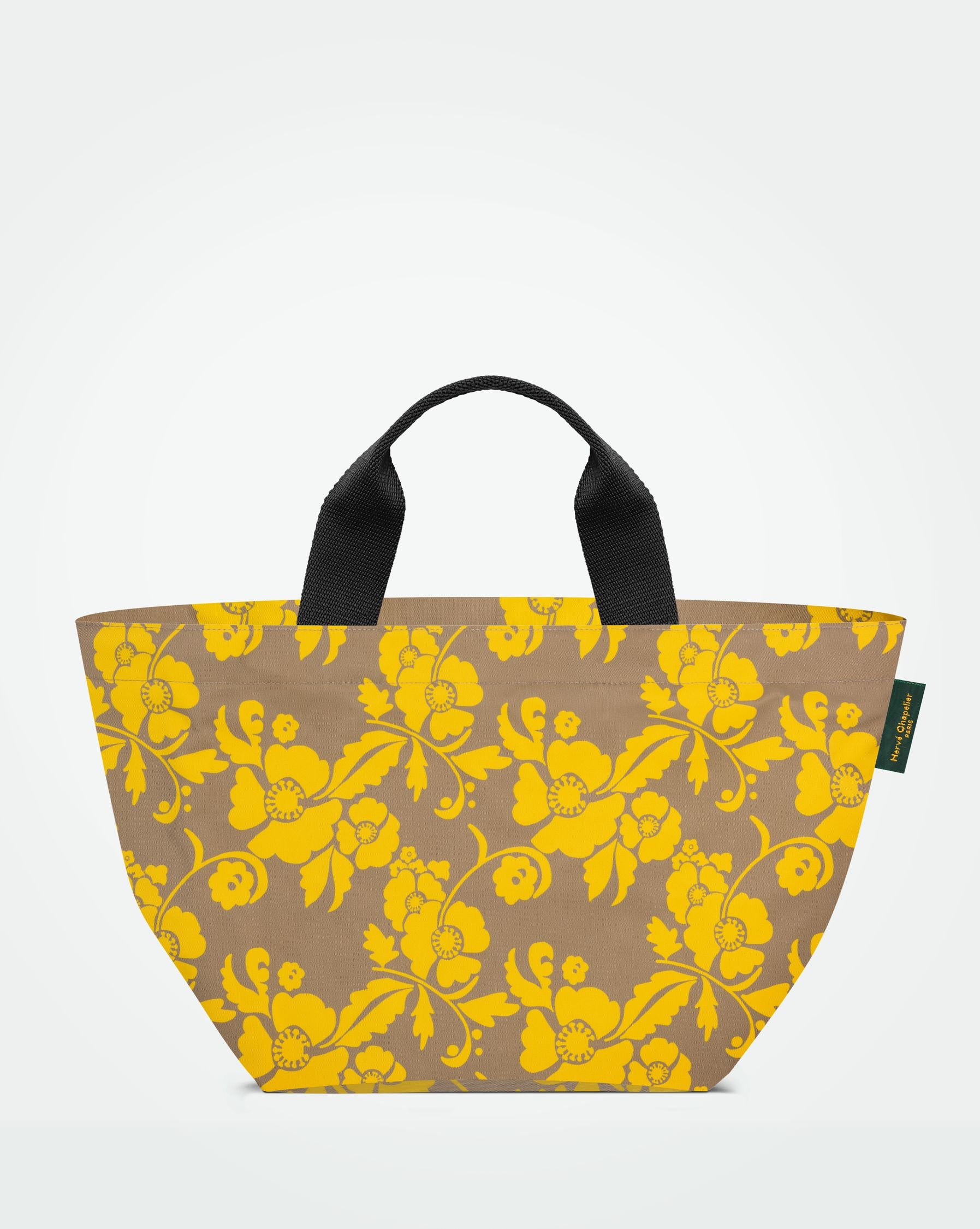 Packshot of a 1027F tote bag with short polyprop handle and a zipper and an inside pocket. The bag is made of printed nylon in a medium size. Sac cabas a poignees courtes en nylon imprime dans un format M
