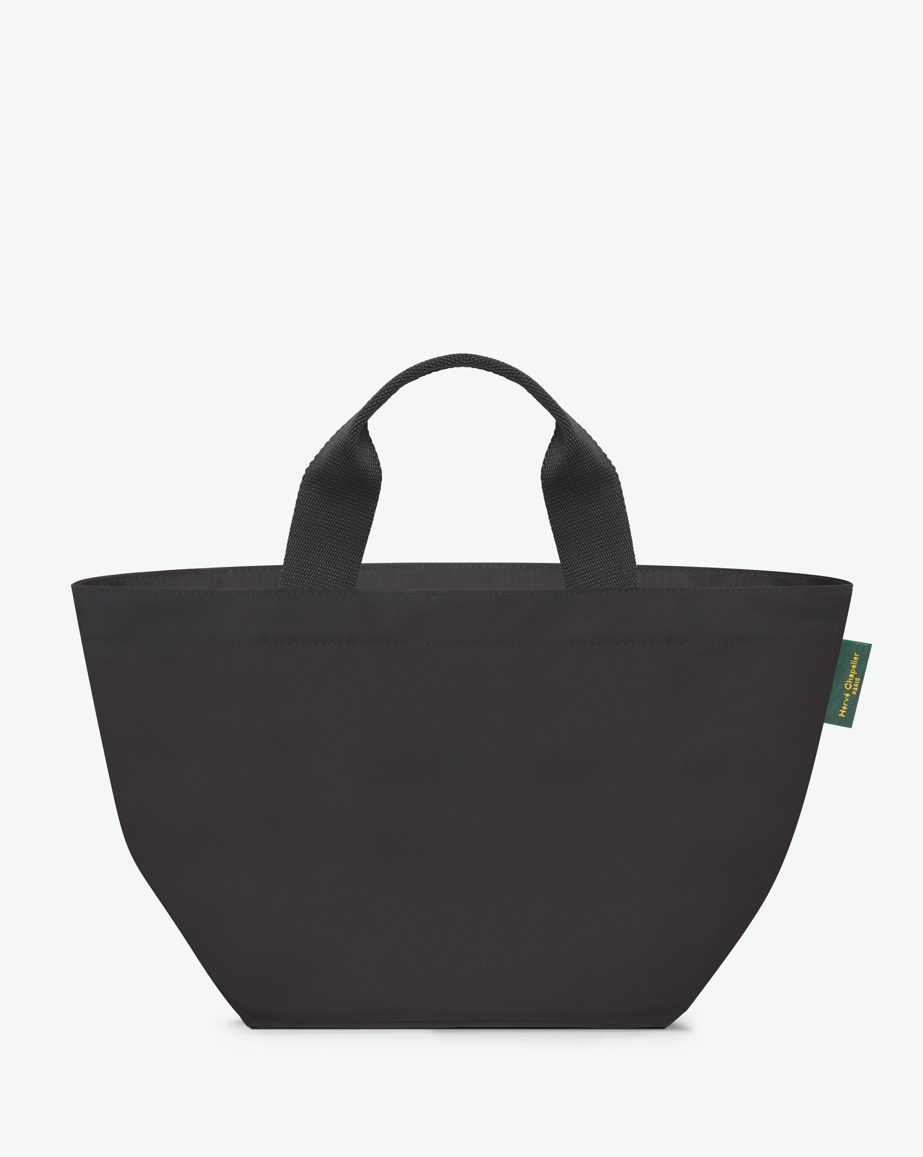 Sac à main cabas de couleur en nylon bicolore, à fond carré et dans un format M. Présence d'un double zip, de poignées courtes noires en polypropylène, et d'une étiquette de marque verte.