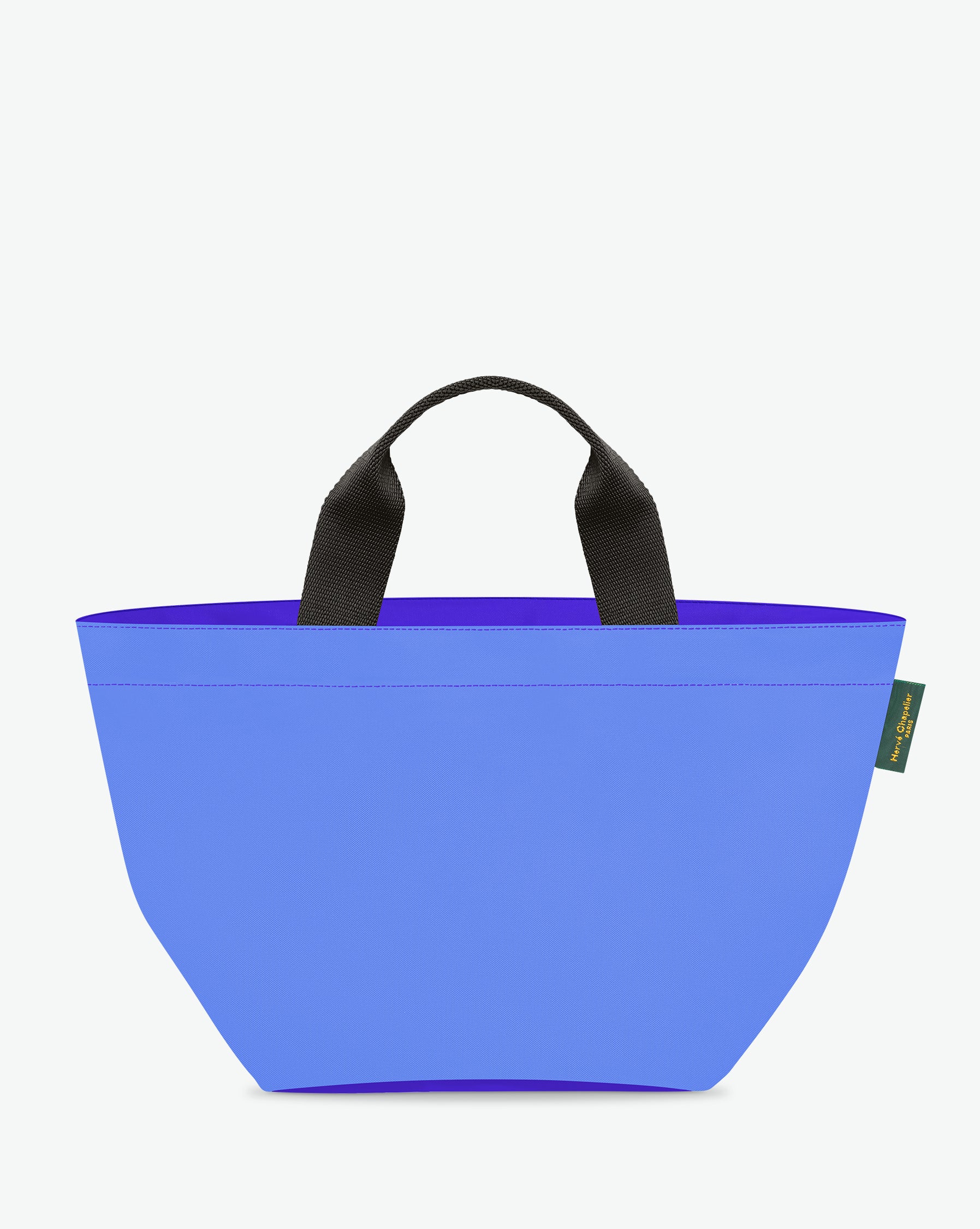 Sac à main cabas de couleur en nylon bicolore, à fond carré et dans un format M. Présence d'un double zip, de poignées courtes noires en polypropylène, et d'une étiquette de marque verte.