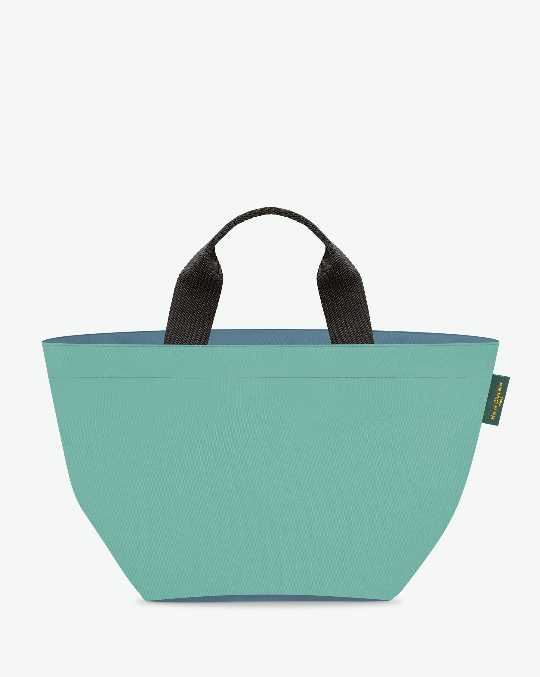 Sac à main cabas de couleur en nylon bicolore, à fond carré et dans un format M. Présence d'un double zip, de poignées courtes noires en polypropylène, et d'une étiquette de marque verte.