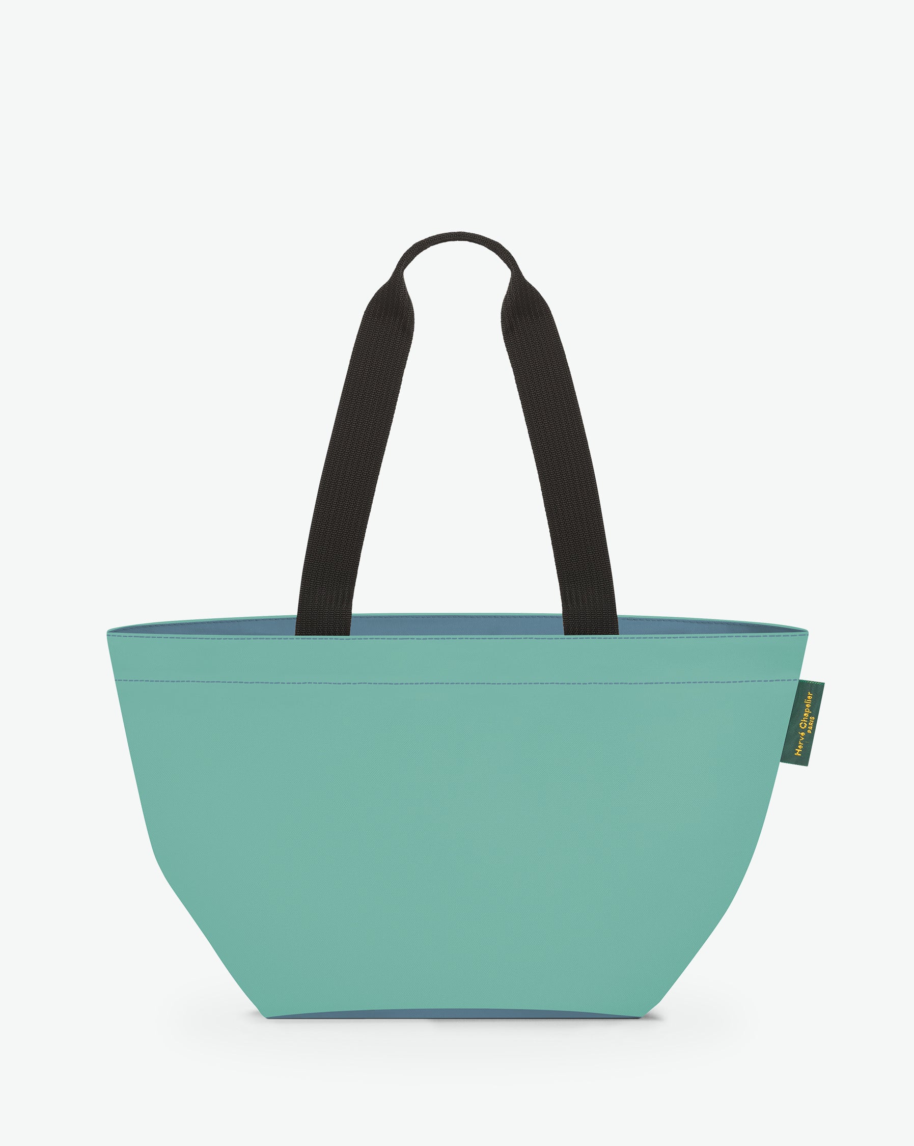 Sac cabas porté épaule de couleur en nylon bicolore, à fond carré et dans un format M. Présence d'un double zip, d'anses longues noires en polypropylène, et d'une étiquette de marque verte.