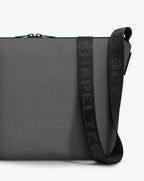 Packshot of a 1754CJQ shoulder crossbody bag with a large and long labeled “Chapelier” handle in polyamide The bag is made of solid polyamide, in a rectangular size Sac bandouliere epaule en nylon uni taille L
