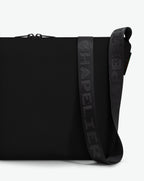 Packshot of a 1754CJQ shoulder crossbody bag with a large and long labeled “Chapelier” handle in polyamide The bag is made of solid polyamide, in a rectangular size Sac bandouliere epaule en nylon uni taille L