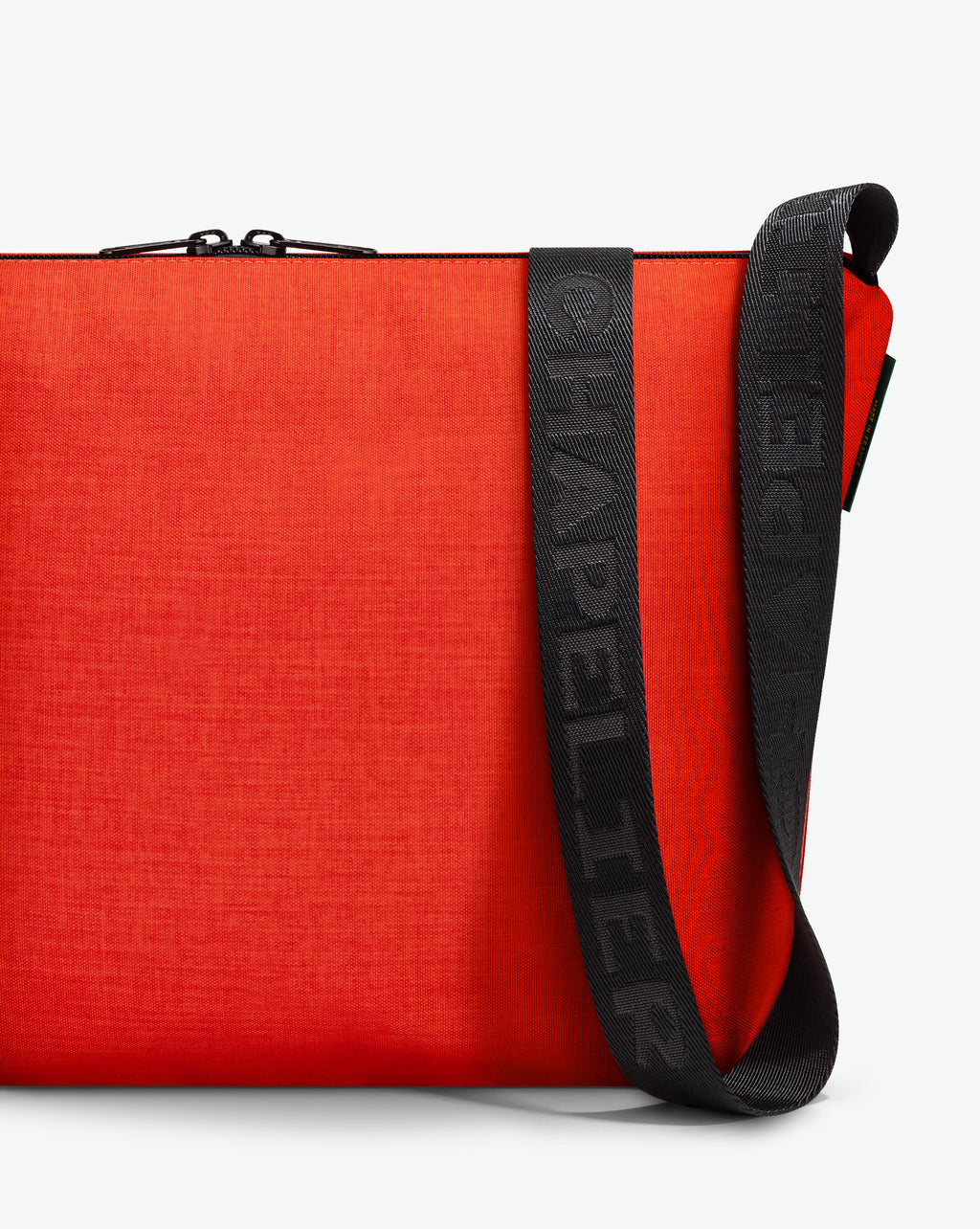 Packshot of a 1754CJQ shoulder crossbody bag with a large and long labeled “Chapelier” handle in polyamide The bag is made of solid polyamide, in a rectangular size Sac bandouliere epaule en nylon uni taille L