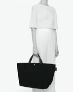 Packshot of a 1837C travel bag rectangular bottom with short polycotton handles and a zipper and an inside pocket. The bag is made of polyamide in a large size. Sac cabas a poignees courtes en polyamide uni format L
