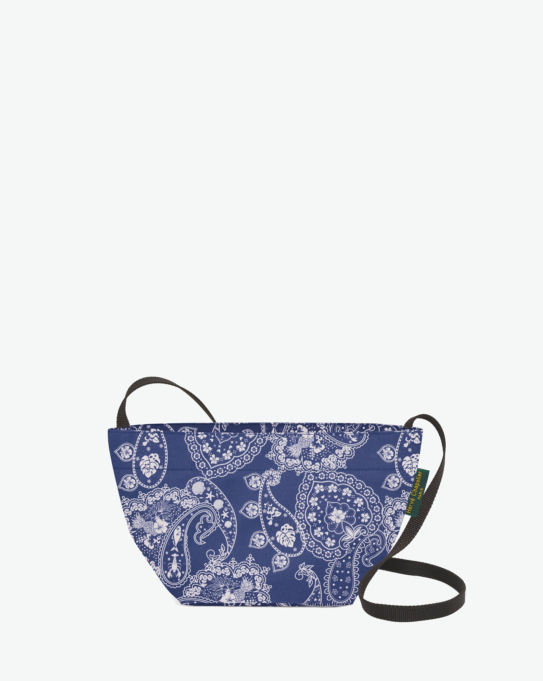 Packshot of a 1927F shoulder crossbody bag with a long handle in polyamide webbing and a zipper. The bag is made of printed nylon in an extra-small size. Mini sac bandouliere epaule en nylon imprime taille XS