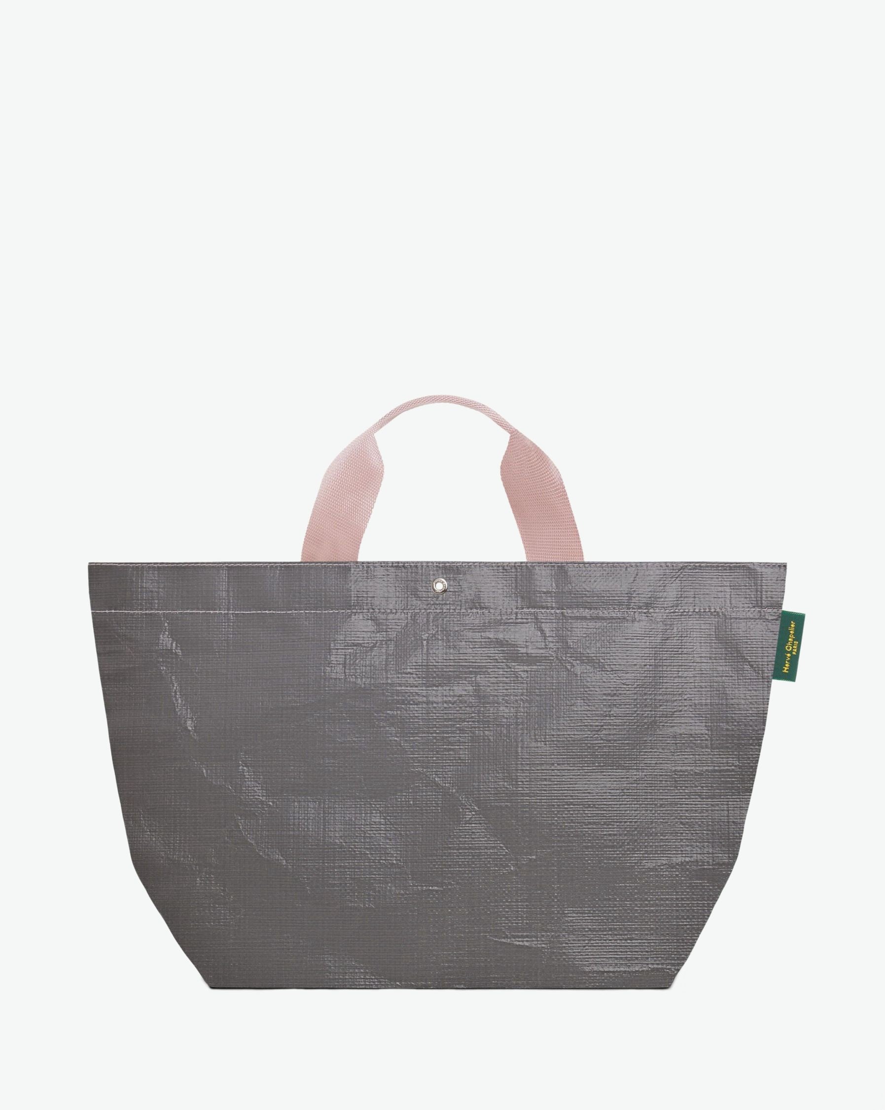 Sac cabas marché coloré en polypropylène, à fond rectangulaire et dans une taille M, aux poignées courtes de couleur en polyamide et à l'œillet décoratif.