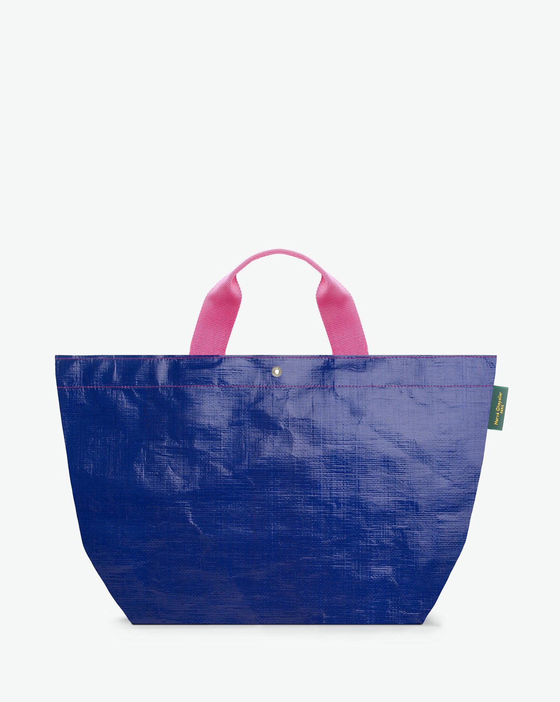 Sac cabas marché coloré en polypropylène, à fond rectangulaire et dans une taille M, aux poignées courtes de couleur en polyamide et à l'œillet décoratif.