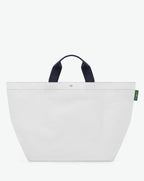 Sac cabas marché coloré en polypropylène, à fond carré et dans une taille XL, aux poignées courtes de couleur en polyamide et à l'œillet décoratif.