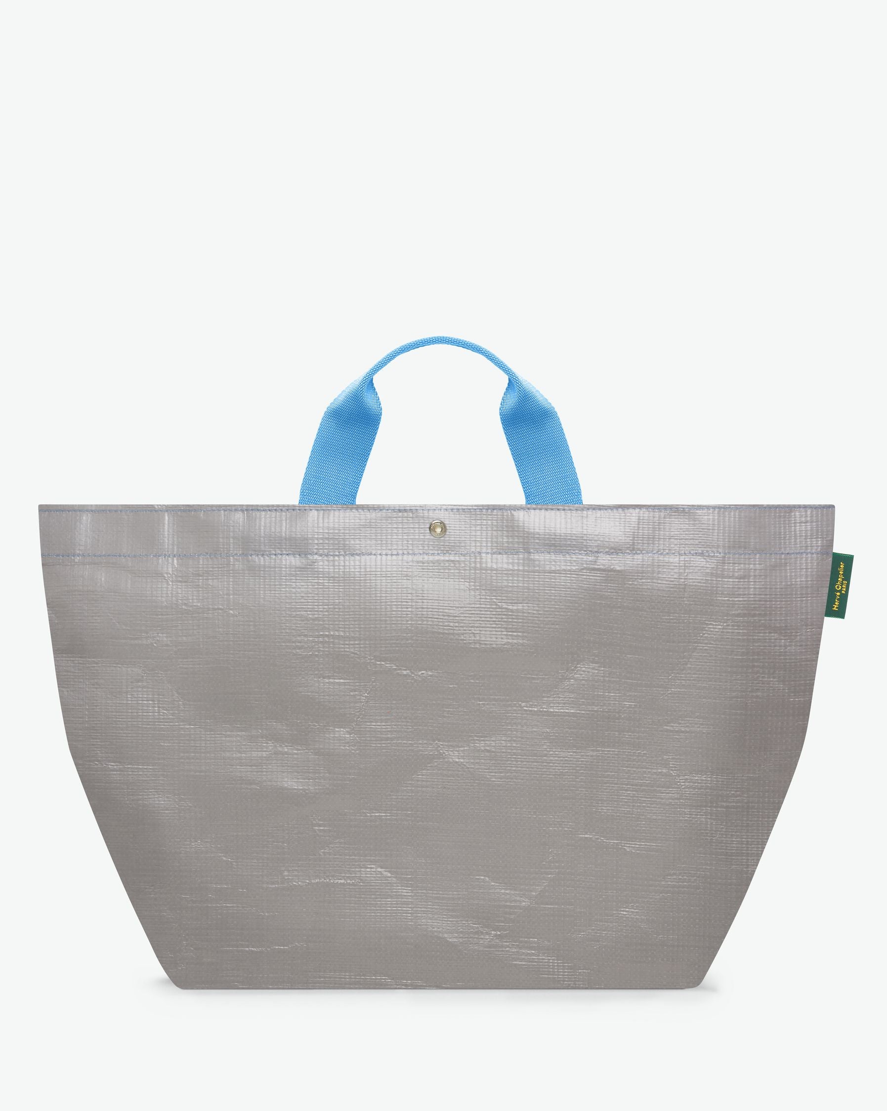 Sac cabas marché coloré en polypropylène, à fond carré et dans une taille XL, aux poignées courtes de couleur en polyamide et à l'œillet décoratif.