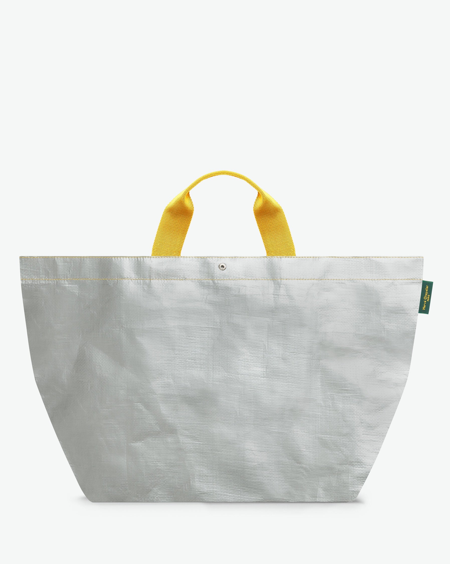 Sac cabas marché coloré en polypropylène, à fond carré et dans une taille XL, aux poignées courtes de couleur en polyamide et à l'œillet décoratif.