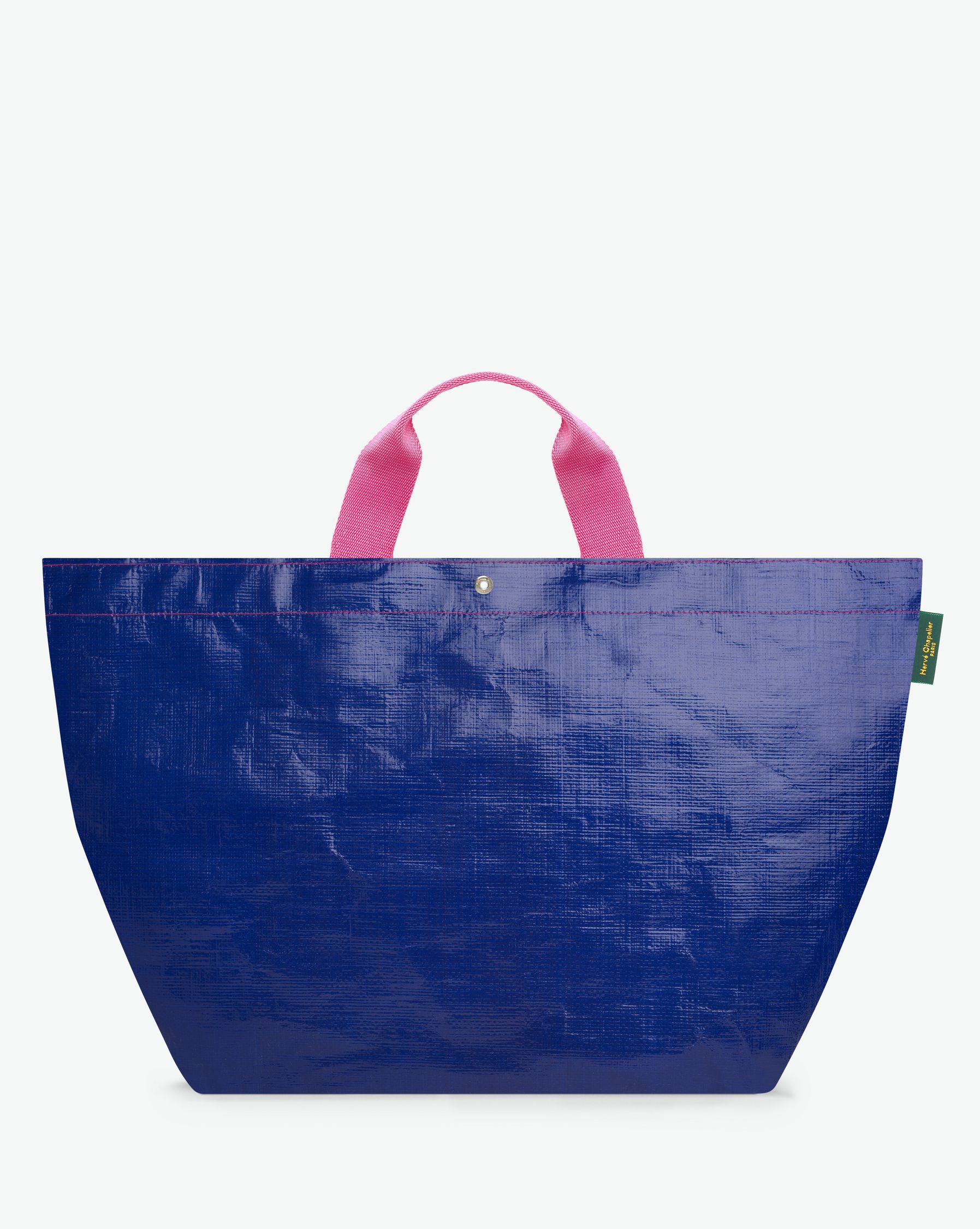 Sac cabas marché coloré en polypropylène, à fond carré et dans une taille XL, aux poignées courtes de couleur en polyamide et à l'œillet décoratif.