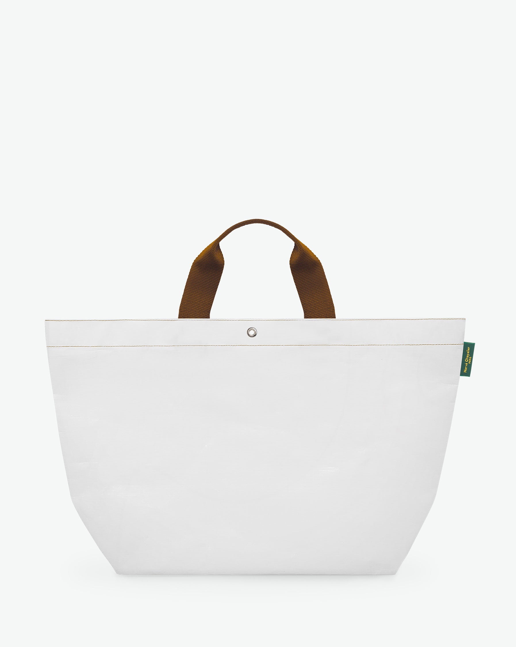 Sac cabas marché coloré en polypropylène, à fond rectangulaire et dans une taille L, aux poignées courtes de couleur en polyamide et à l'œillet décoratif.