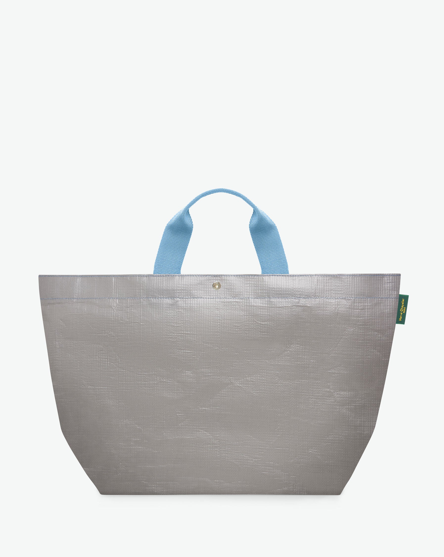 Sac cabas marché coloré en polypropylène, à fond rectangulaire et dans une taille L, aux poignées courtes de couleur en polyamide et à l'œillet décoratif.