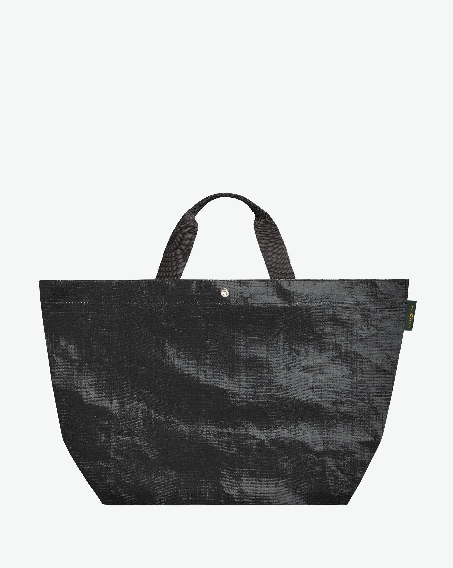 Sac cabas marché coloré en polypropylène, à fond rectangulaire et dans une taille L, aux poignées courtes de couleur en polyamide et à l'œillet décoratif.