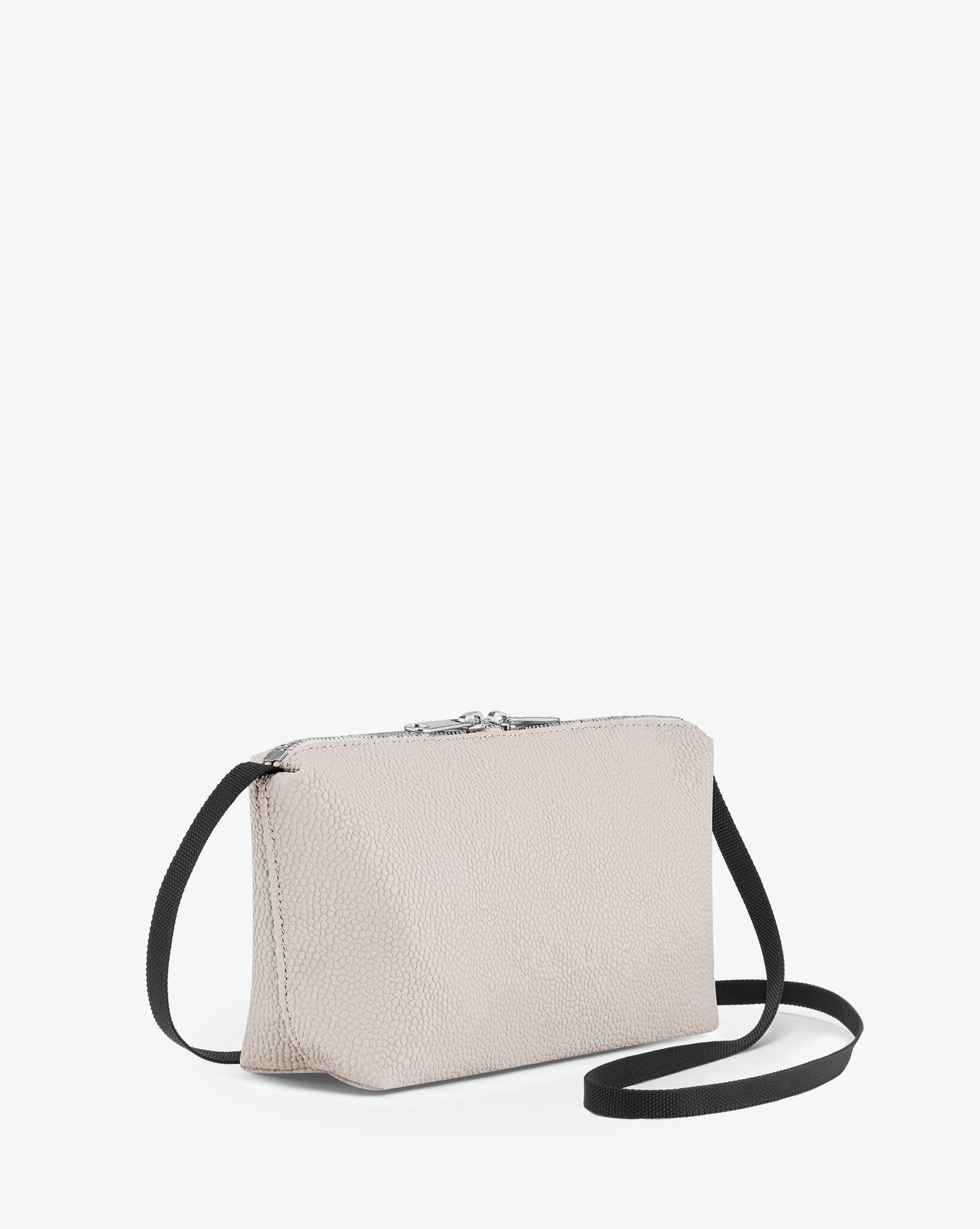 Packshot of a 2784G rectangular crossbody bag with a zipper and a long handle in polyamide webbing in a size S. Bag made of pebbled grain coated canvas. Sac bandoulière toile enduite dans une taille S