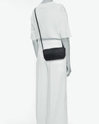 Packshot of a 2784G rectangular crossbody bag with a zipper and a long handle in polyamide webbing in a size S. Bag made of pebbled grain coated canvas. Sac bandoulière toile enduite dans une taille S