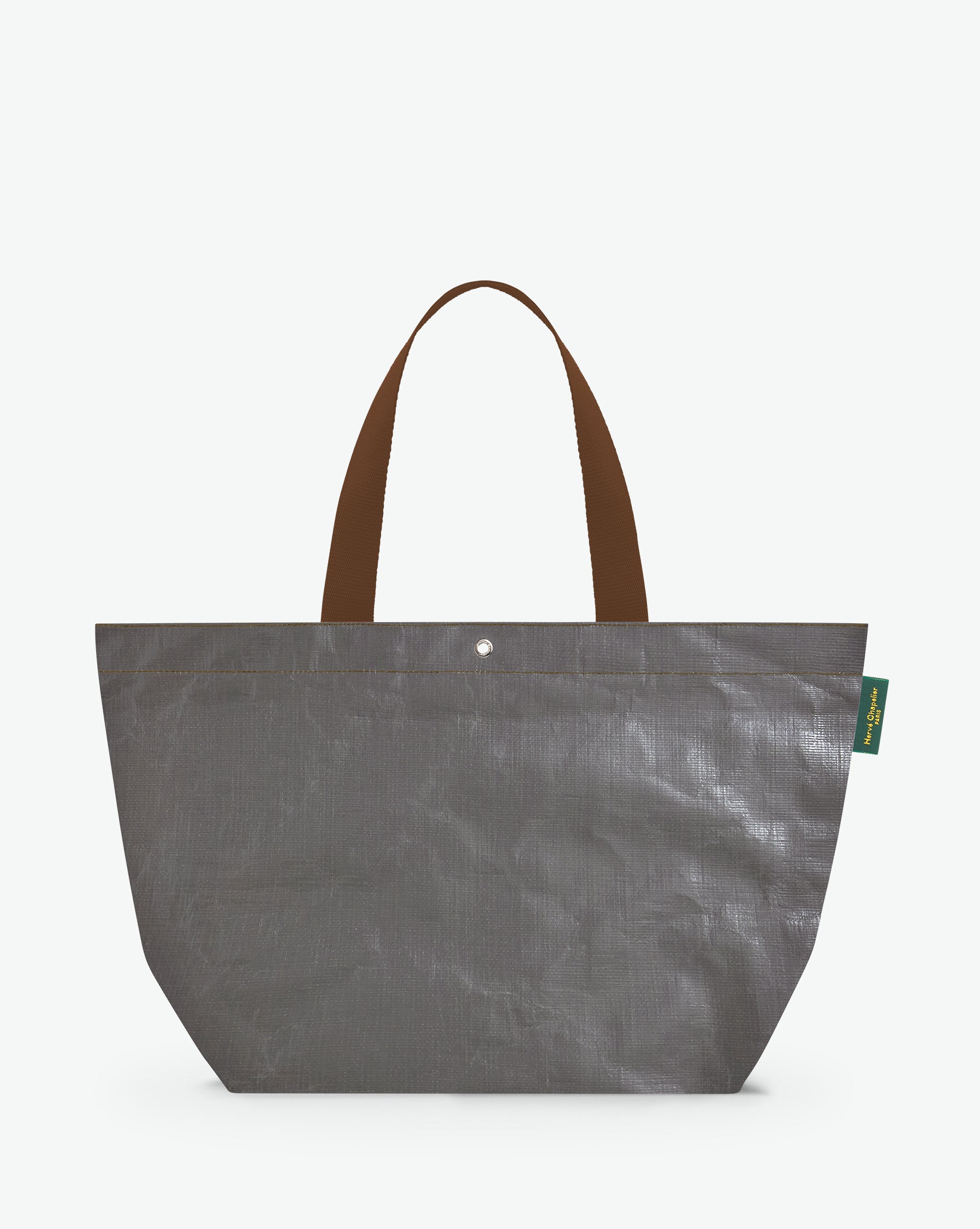 Sac cabas marché coloré en polypropylène, à fond rectangulaire et dans une taille L, aux poignées longues de couleur en polyamide et à l'œillet décoratif. Idéal pour un porté à l'épaule.