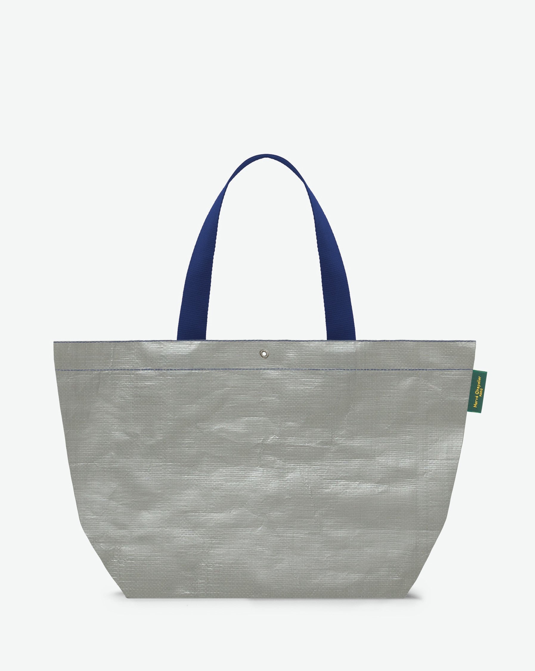 Sac cabas marché coloré en polypropylène, à fond rectangulaire et dans une taille L, aux poignées longues de couleur en polyamide et à l'œillet décoratif. Idéal pour un porté à l'épaule.