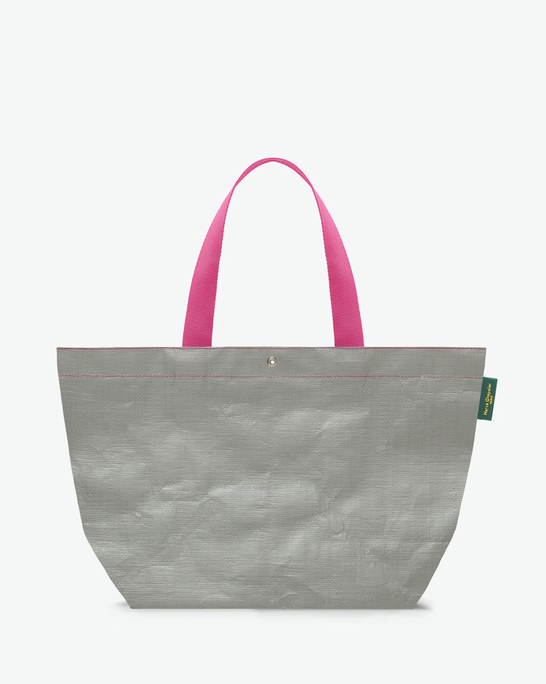 Sac cabas marché coloré en polypropylène, à fond rectangulaire et dans une taille L, aux poignées longues de couleur en polyamide et à l'œillet décoratif. Idéal pour un porté à l'épaule.