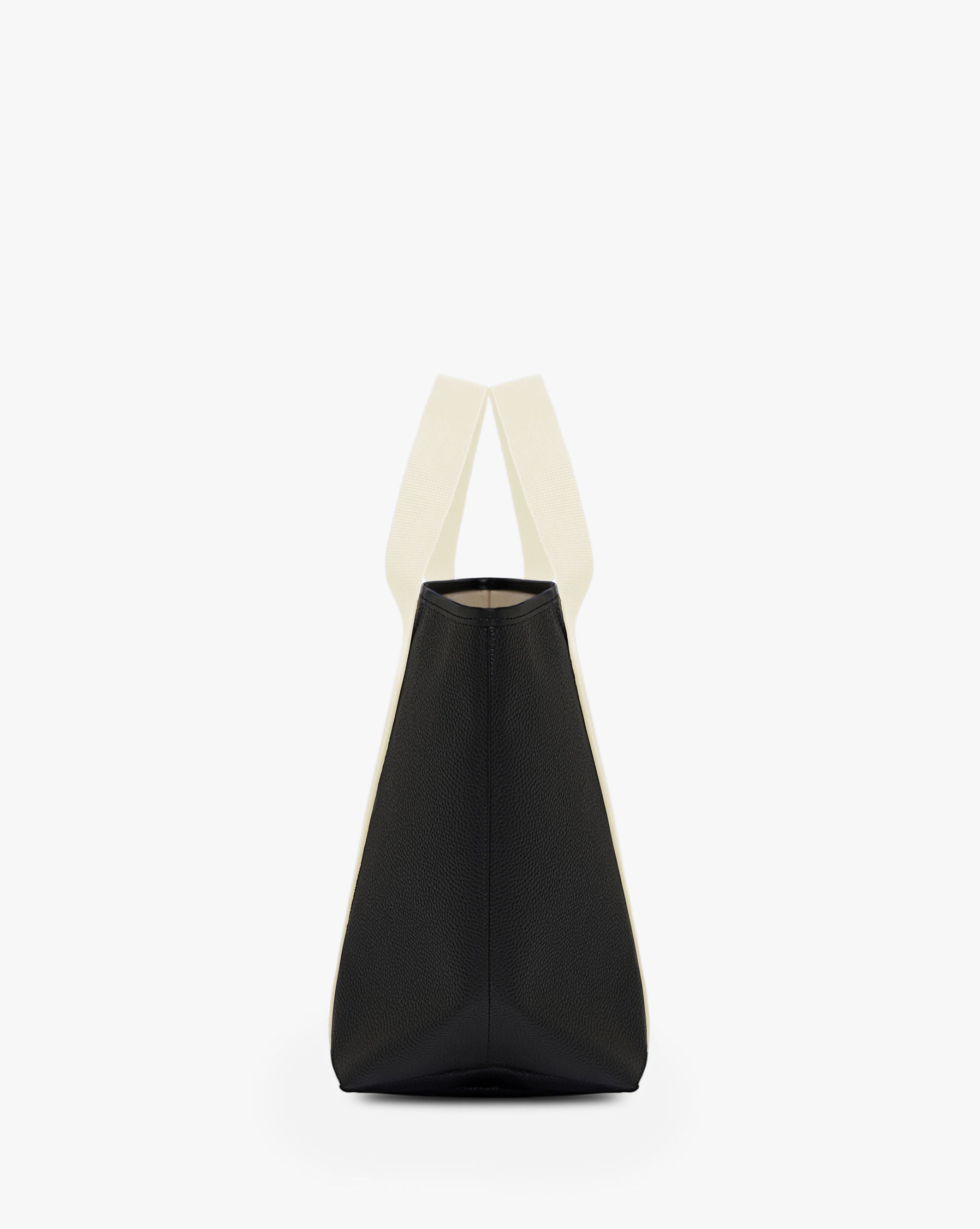 Sac à main en toile enduite grainée, à fond rectangulaire et dans une taille M, et aux poignées courtes de couleur à l'aspect coton faisant le tour du sac.