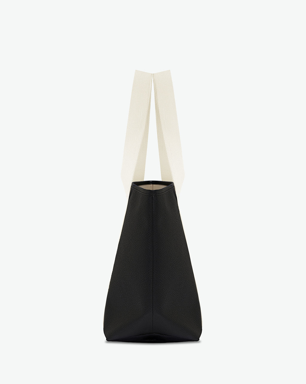 Sac porté épaule en toile enduite grainée, à fond rectangulaire et dans une taille M, et aux poignées longues de couleur à l'aspect coton faisant le tour du sac.