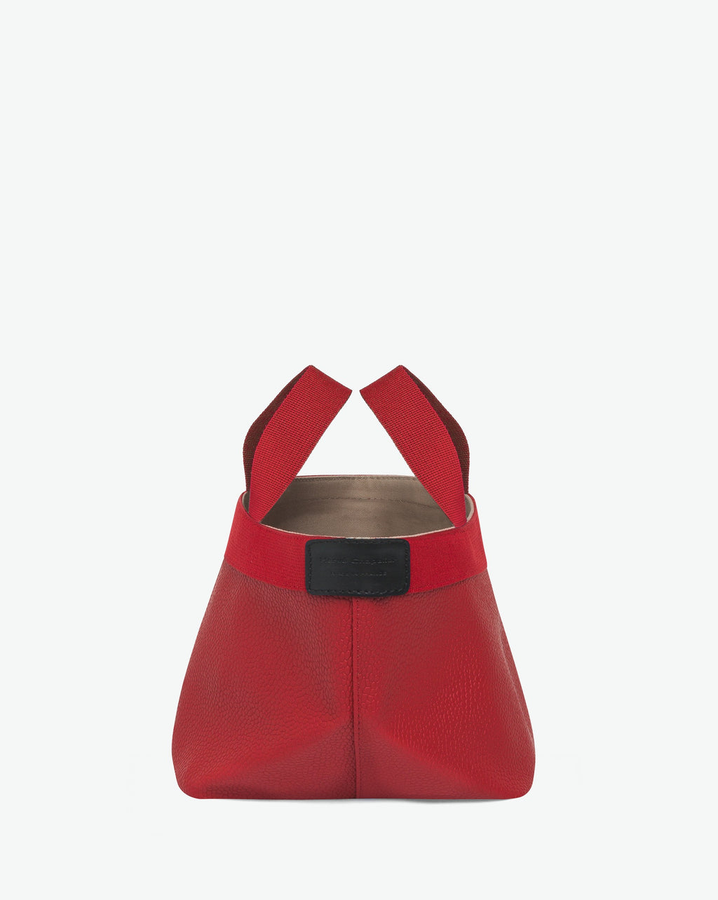 Sac à main en toile enduite grainée en taille S, au fond carré et aux poignées courtes de couleur à l'aspect coton, ainsi qu'à la poche intérieure avec bouton pression.