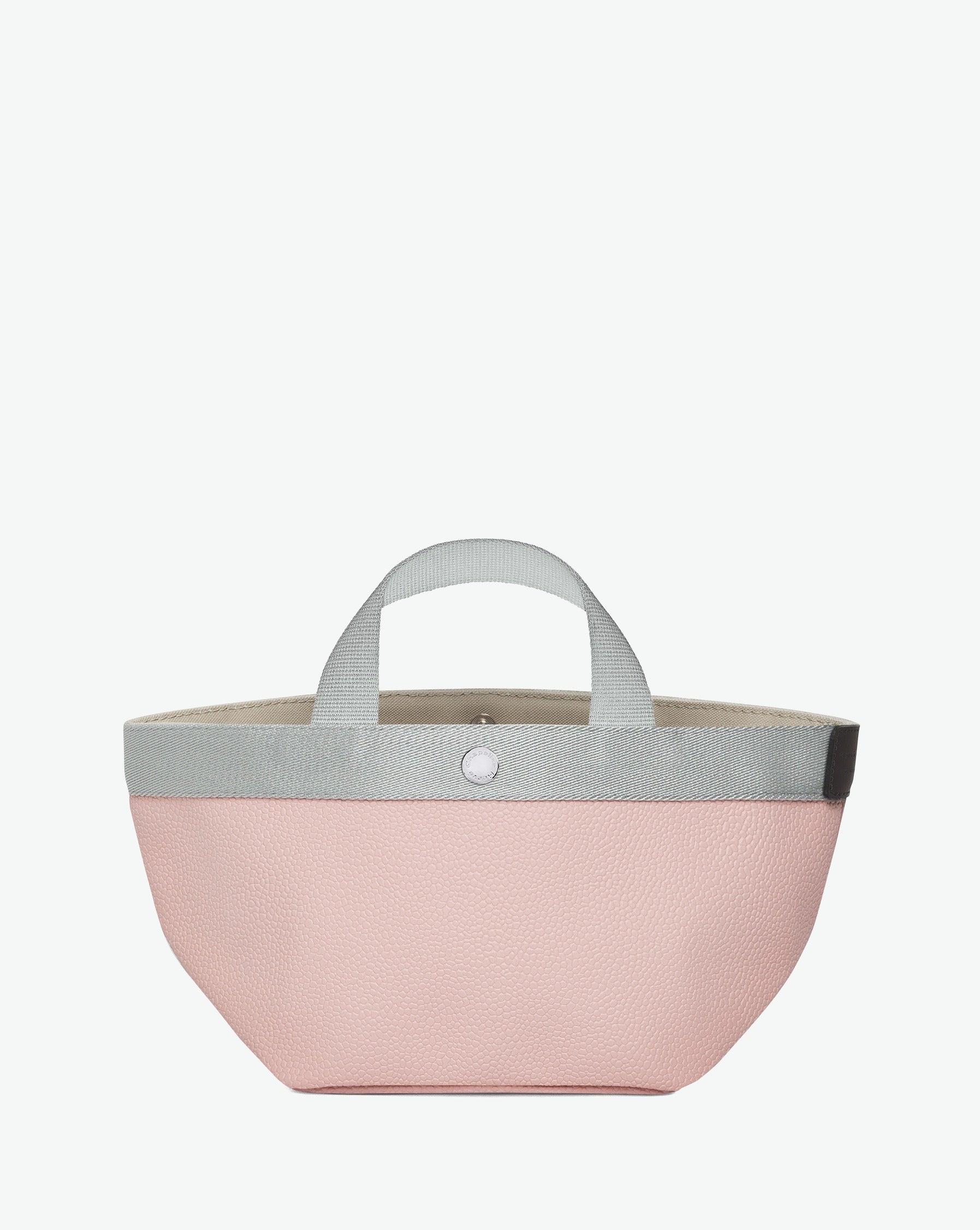 Sac à main en toile enduite grainée en taille S, au fond carré et aux poignées courtes de couleur à l'aspect coton, ainsi qu'à la poche intérieure avec bouton pression.