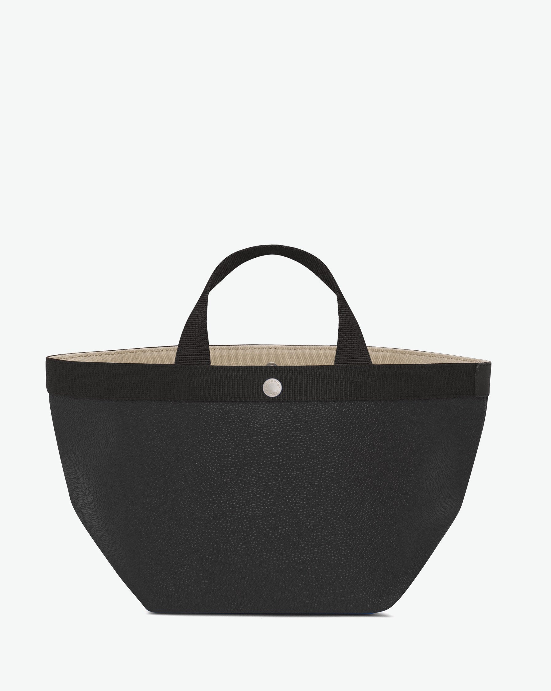 Sac à main en toile enduite grainée en taille M, au fond carré et aux poignées courtes de couleur à l'aspect coton, ainsi qu'à la poche intérieure avec bouton pression.