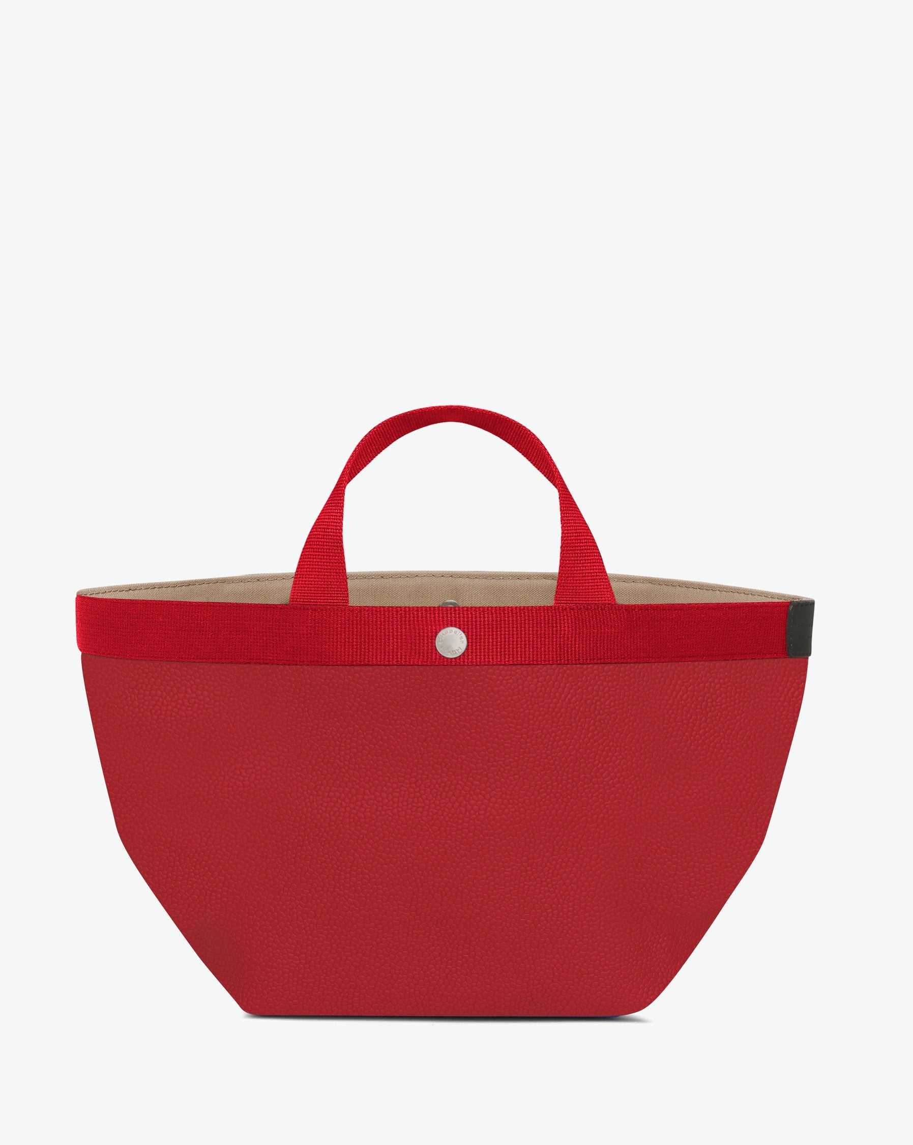 Sac à main en toile enduite grainée en taille M, au fond carré et aux poignées courtes de couleur à l'aspect coton, ainsi qu'à la poche intérieure avec bouton pression.