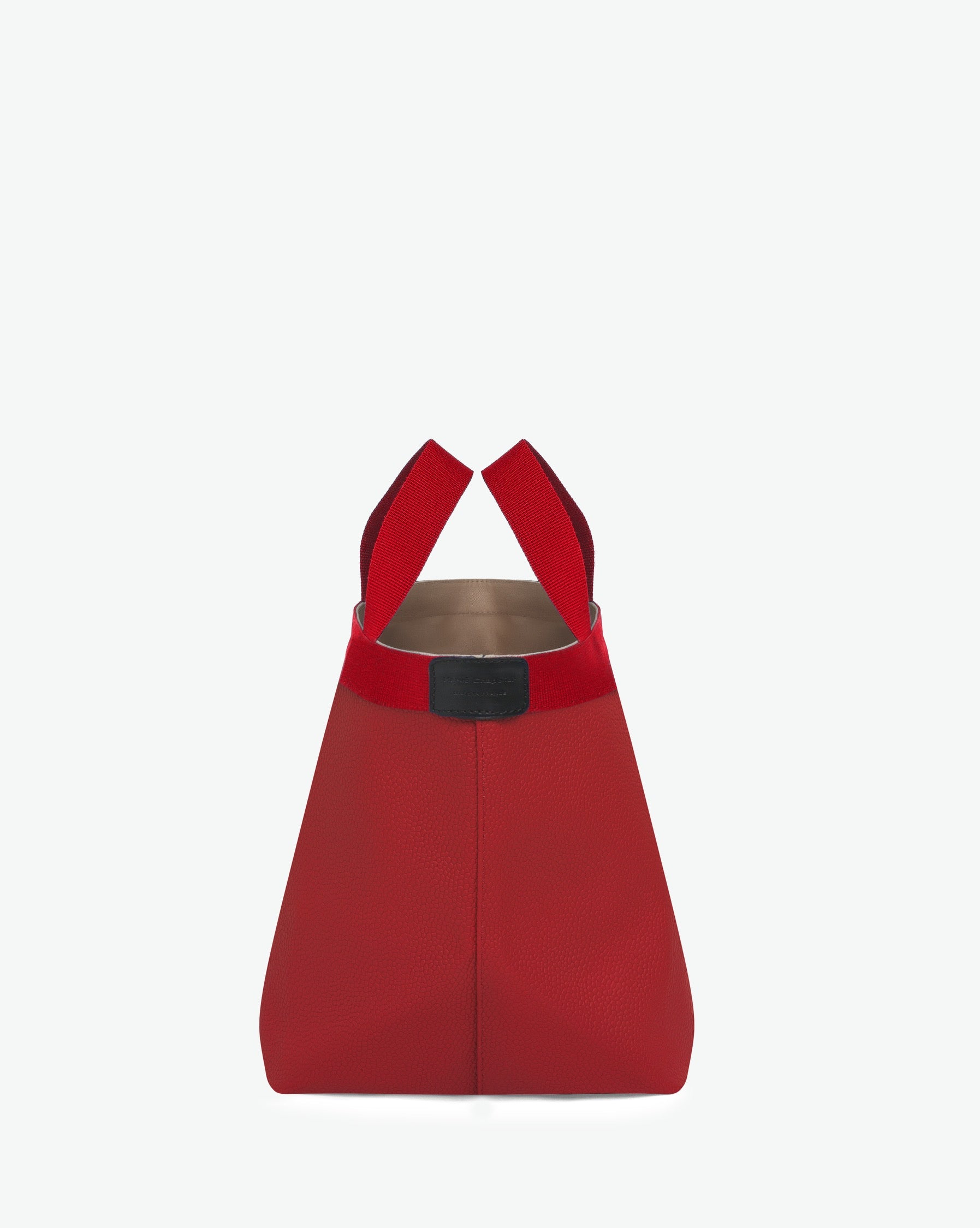 Sac à main en toile enduite grainée en taille M, au fond carré et aux poignées courtes de couleur à l'aspect coton, ainsi qu'à la poche intérieure avec bouton pression.