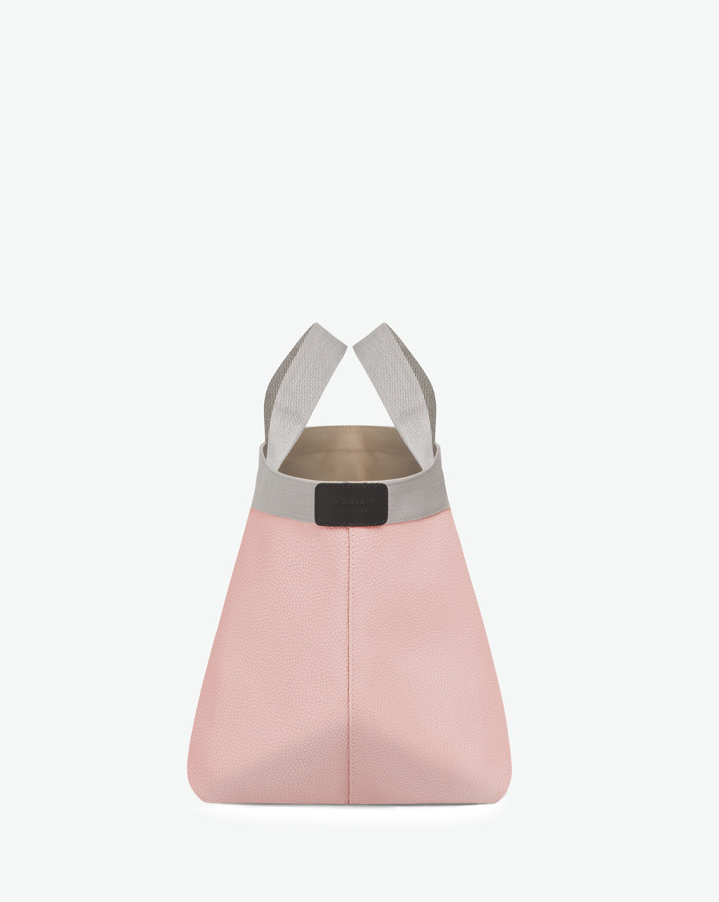 Sac à main en toile enduite grainée en taille M, au fond carré et aux poignées courtes de couleur à l'aspect coton, ainsi qu'à la poche intérieure avec bouton pression.