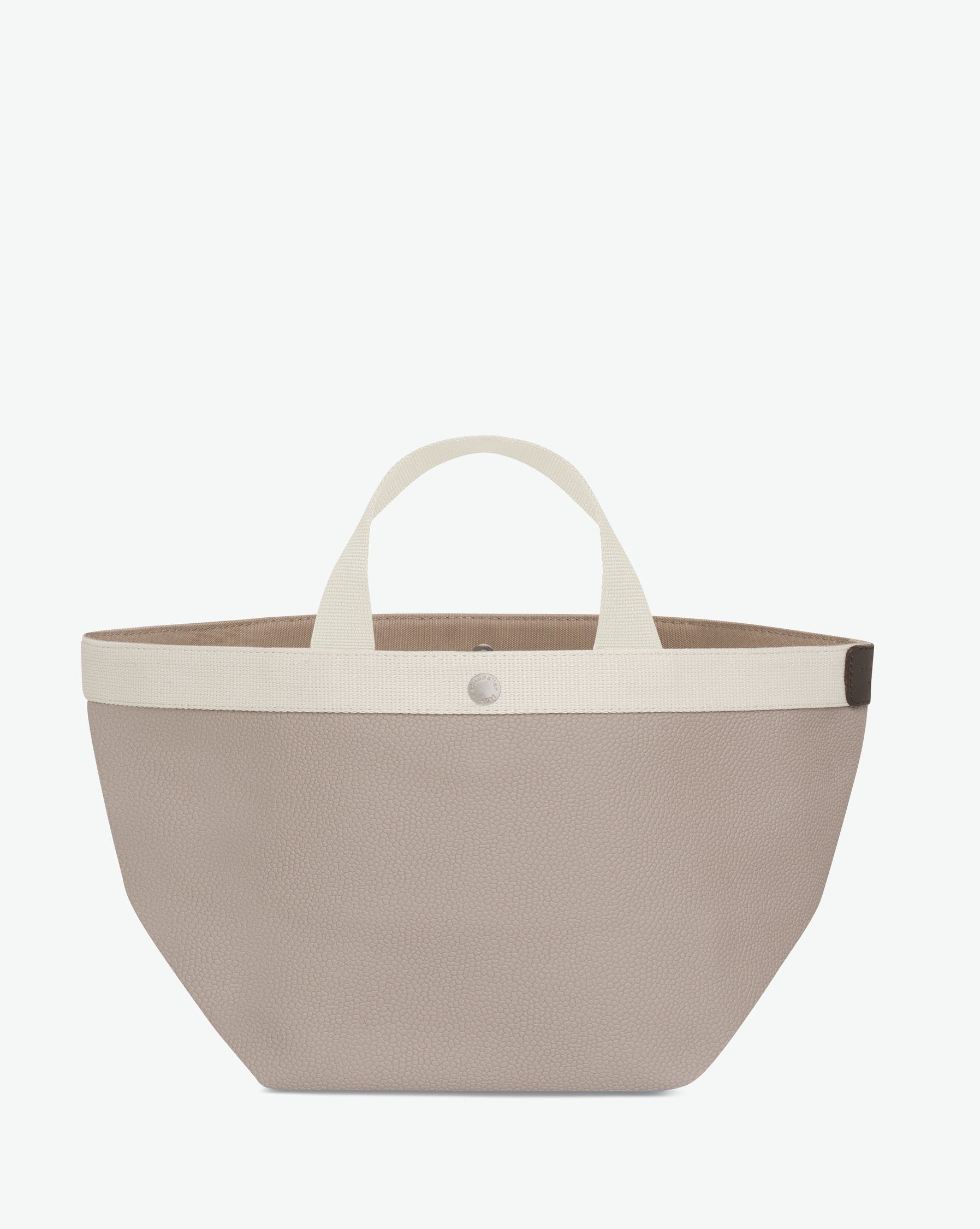 Sac à main en toile enduite grainée en taille M, au fond carré et aux poignées courtes de couleur à l'aspect coton, ainsi qu'à la poche intérieure avec bouton pression.