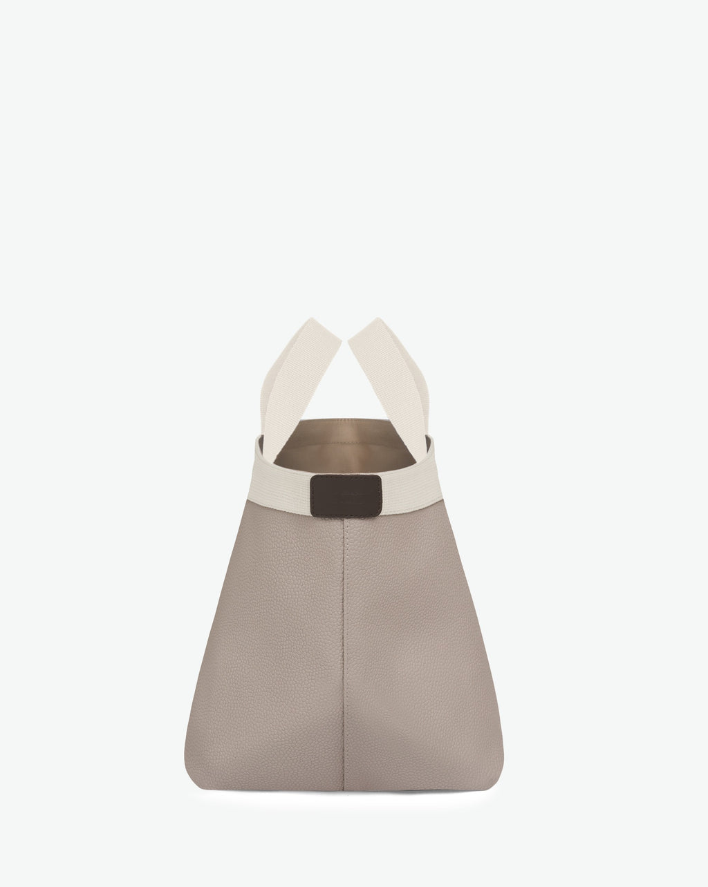 Sac à main en toile enduite grainée en taille M, au fond carré et aux poignées courtes de couleur à l'aspect coton, ainsi qu'à la poche intérieure avec bouton pression.