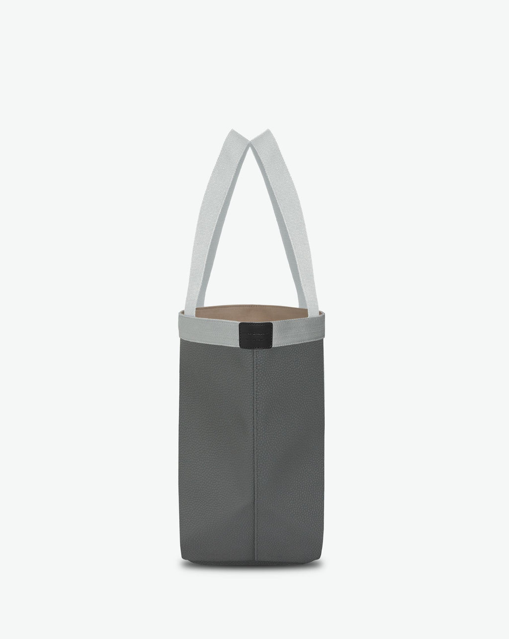 Sac à main en toile enduite grainée en taille L, au fond rectangulaire et aux poignées longues de couleur à l'aspect coton, ainsi qu'à la poche intérieure avec bouton pression.