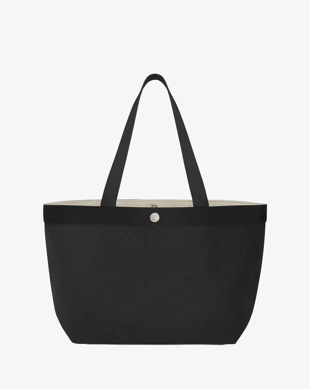 Sac à main en toile enduite grainée en taille L, au fond rectangulaire et aux poignées longues de couleur à l'aspect coton, ainsi qu'à la poche intérieure avec bouton pression.