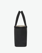 Sac à main en toile enduite grainée en taille L, au fond rectangulaire et aux poignées longues de couleur à l'aspect coton, ainsi qu'à la poche intérieure avec bouton pression.