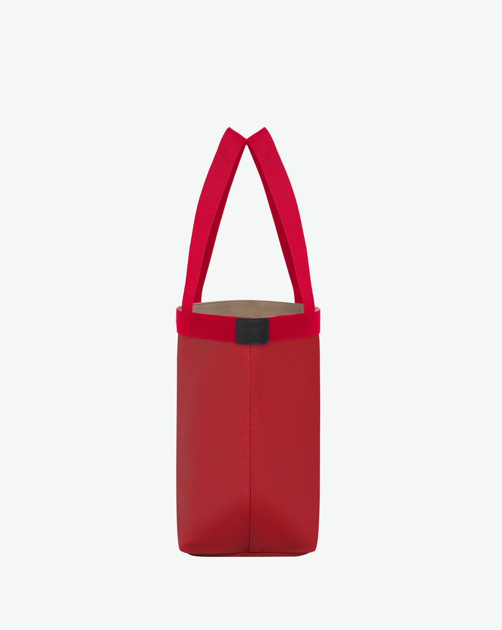 Sac à main en toile enduite grainée en taille L, au fond rectangulaire et aux poignées longues de couleur à l'aspect coton, ainsi qu'à la poche intérieure avec bouton pression.
