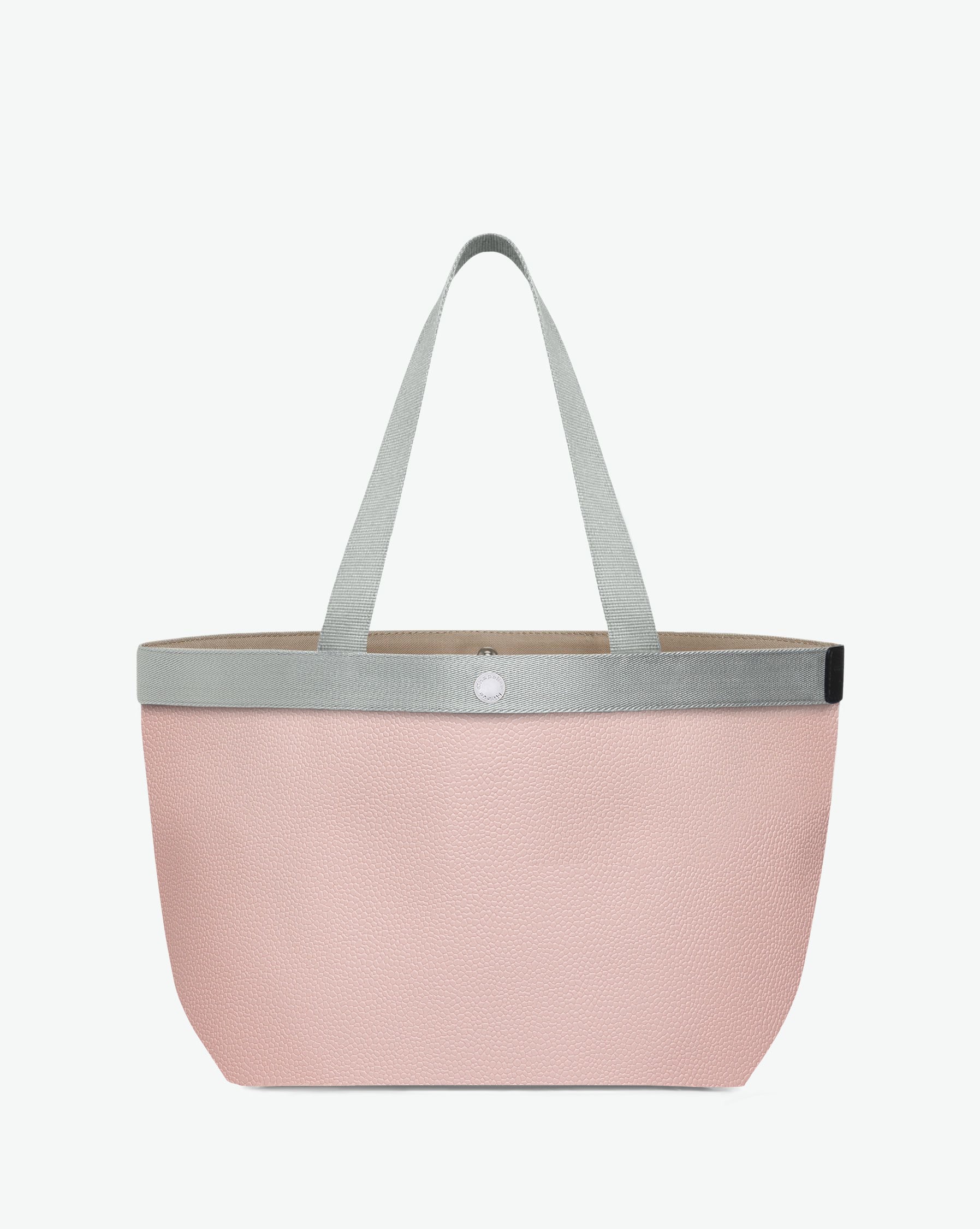 Sac à main en toile enduite grainée en taille L, au fond rectangulaire et aux poignées longues de couleur à l'aspect coton, ainsi qu'à la poche intérieure avec bouton pression.