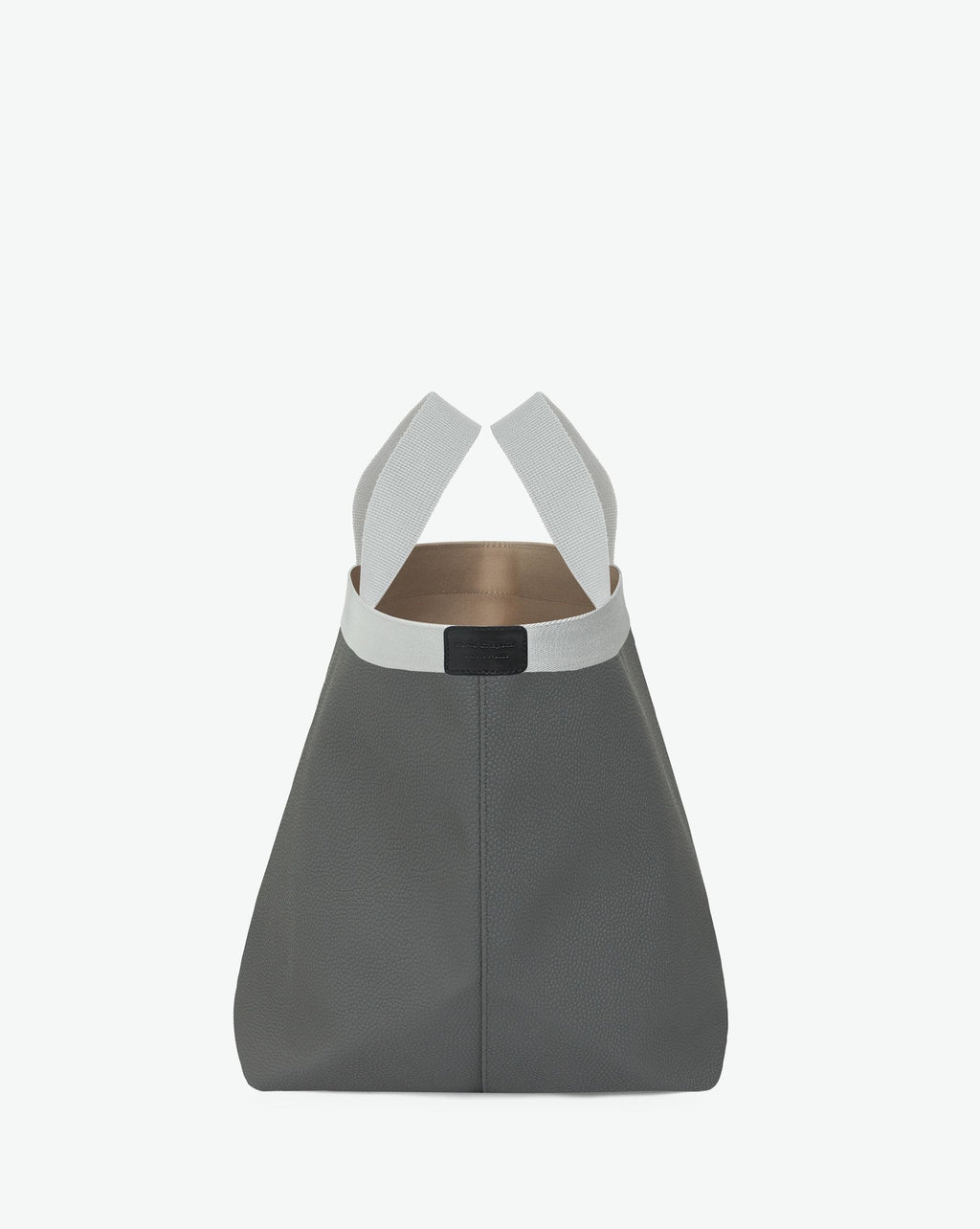 Sac à main en toile enduite grainée en taille L, au fond carré et aux poignées longues de couleur à l'aspect coton, ainsi qu'à la poche intérieure avec bouton pression.