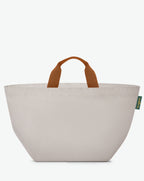 Packshot of a 848C travel bag square bottom with short polycotton handles and a zipper and an inside pocket. This extra-large bag is made of solid polyamide. Sac cabas a poignees courtes en polyamide uni format XL