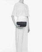 Packshot of a 8784G clutch bag pouch rectangular with a zipper and 2 rings in a small size. The tote is made of pebbled grain coated canvas. Sac pochette rectangulaire toile enduite dans une taille S
