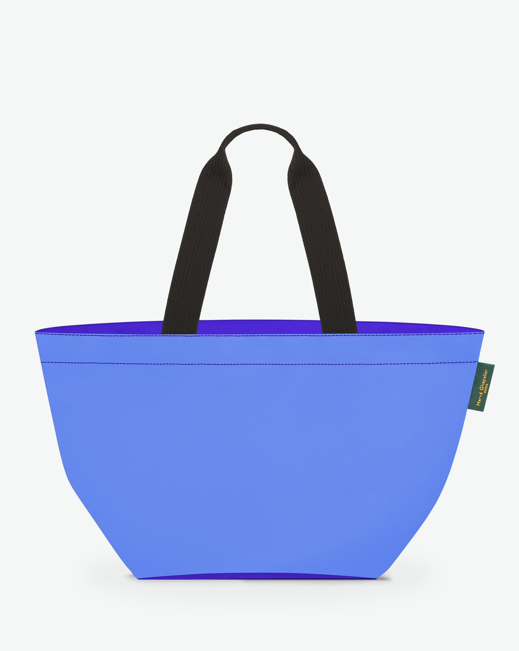 Sac cabas porté épaule de couleur en nylon bicolore, à fond carré et dans un format L. Présence d'un double zip, d'anses longues noires en polypropylène, et d'une étiquette de marque verte.
