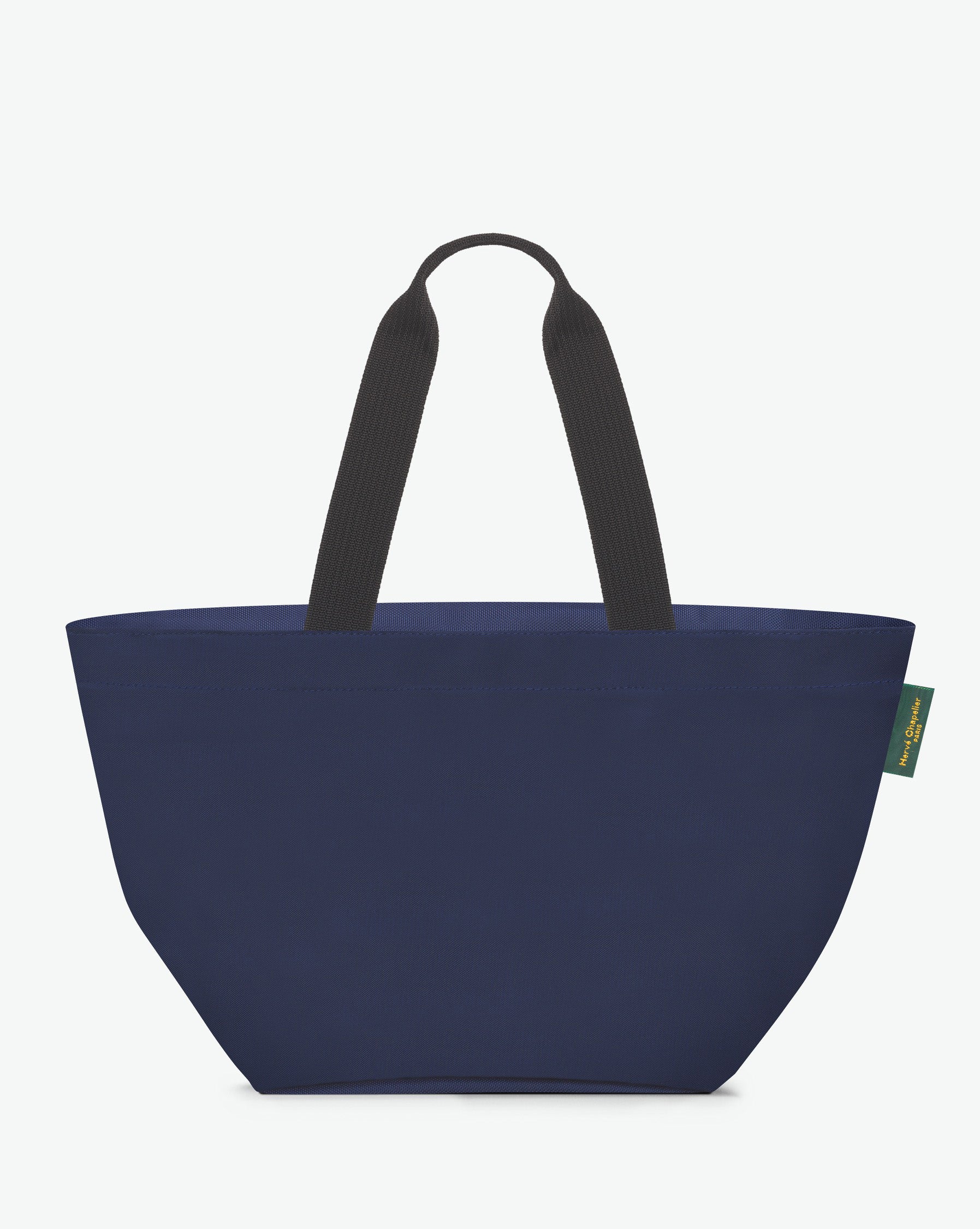 Sac cabas porté épaule de couleur en nylon bicolore, à fond carré et dans un format L. Présence d'un double zip, d'anses longues noires en polypropylène, et d'une étiquette de marque verte.