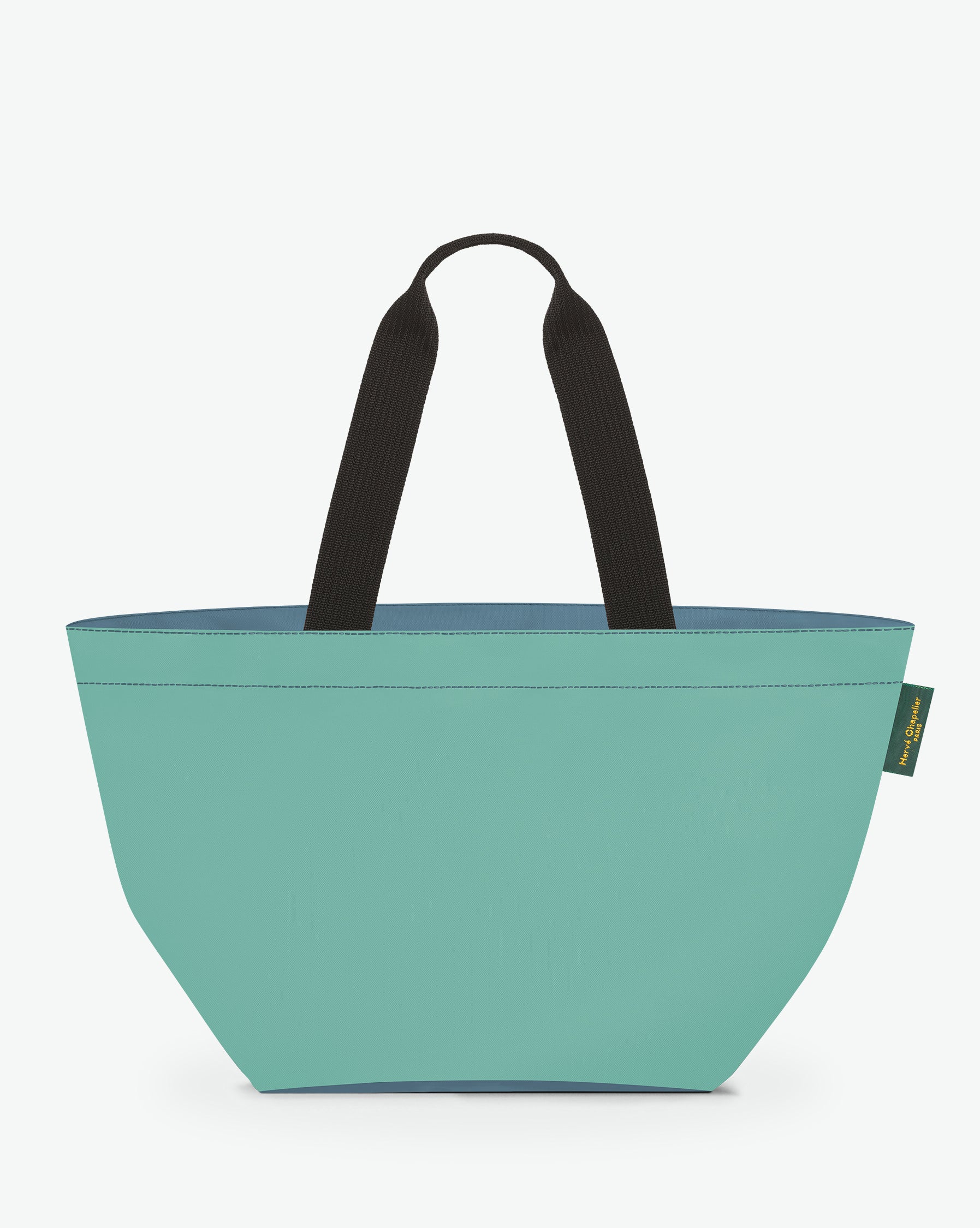 Sac cabas porté épaule de couleur en nylon bicolore, à fond carré et dans un format L. Présence d'un double zip, d'anses longues noires en polypropylène, et d'une étiquette de marque verte.