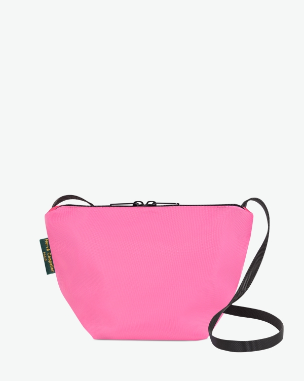 Hervé Chapelier -  - Visual on a white background of a shoulder bag standing upright and straight, with a long handle and a zip with double closure. The bag is made from printed nylon fabric in a pink color. The Hervé Chapelier label is affixed to the left-hand side.