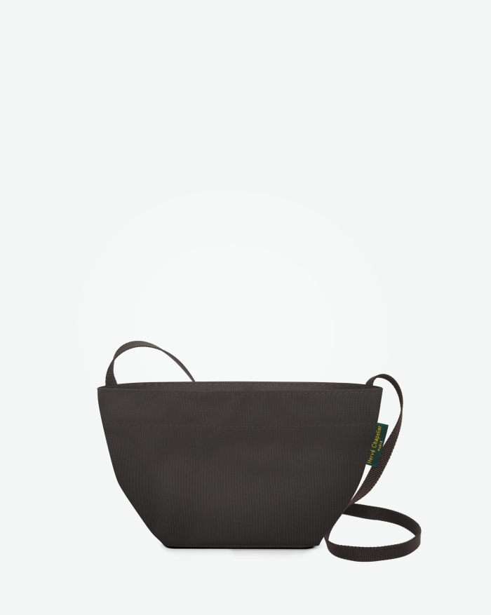 
"Packshot of a 1927N shoulder crossbody bag
with a long handle in polyamide webbing and a zipper.
The bag is made of solid nylon in an extra-small size.
Mini sac bandouliere epaule fond carre uni taille XS"
