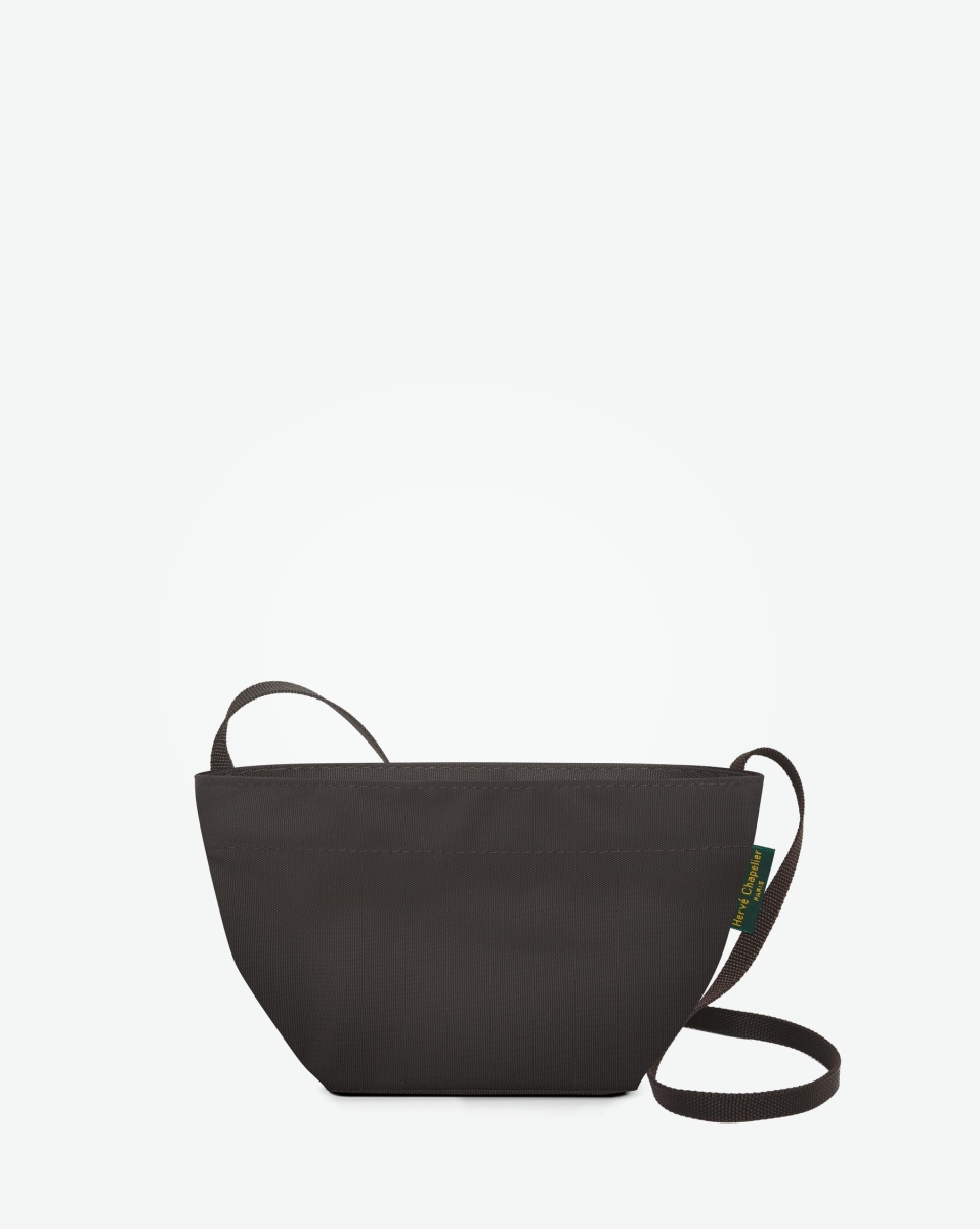 Hervé Chapelier -  - 
"Packshot of a 1927N shoulder crossbody bag
with a long handle in polyamide webbing and a zipper.
The bag is made of solid nylon in an extra-small size.
Mini sac bandouliere epaule fond carre uni taille XS"
